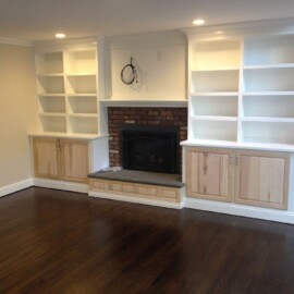 fireplace with wood bookshelves construction