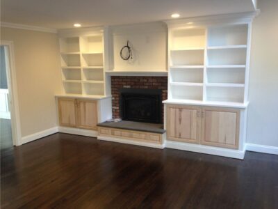 fireplace with wood bookshelves construction